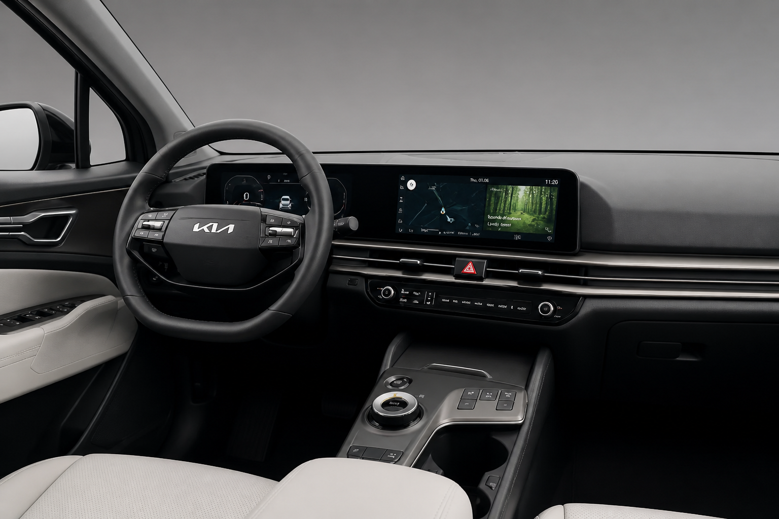 Salpicadero del Kia Sportage con pantallas curvas integradas, volante y consola central