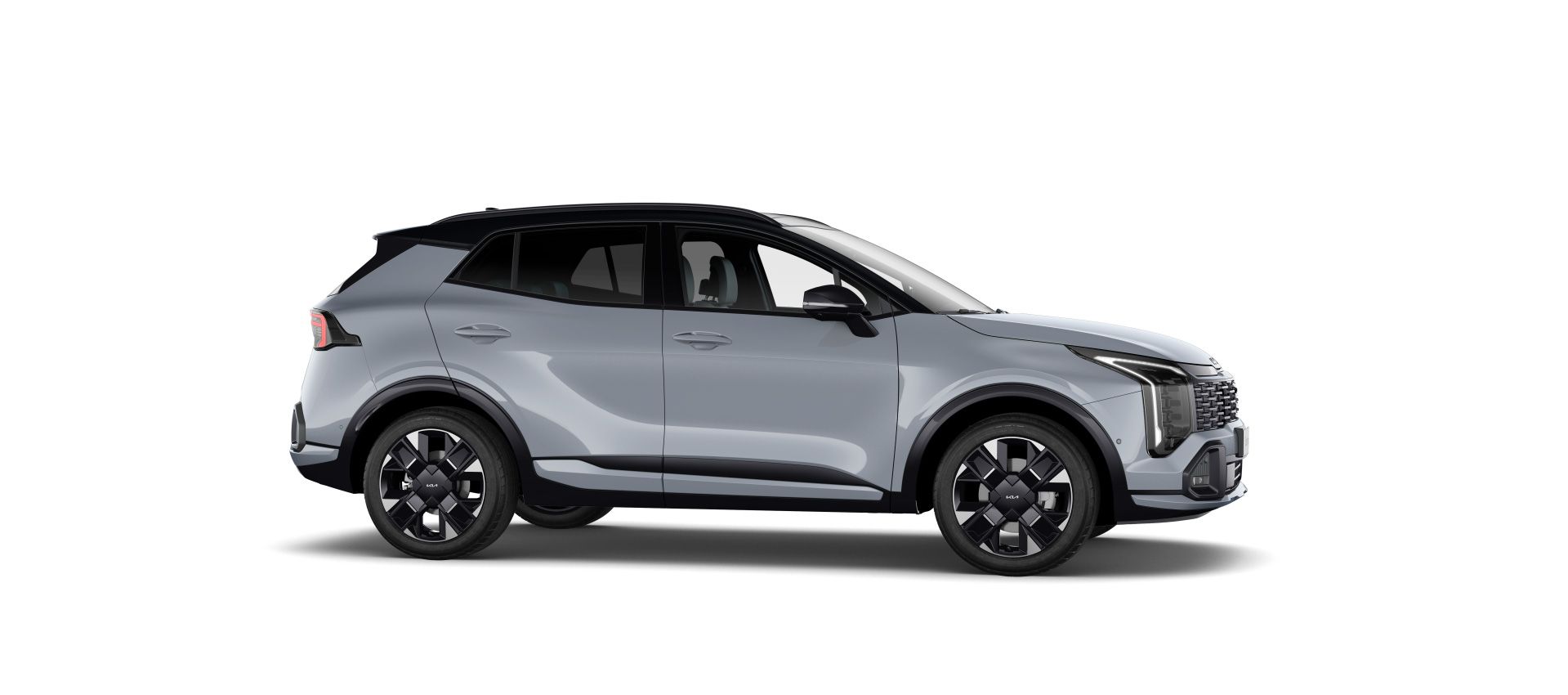 Vista lateral del Kia Sportage gris con techo negro y llantas multirradio