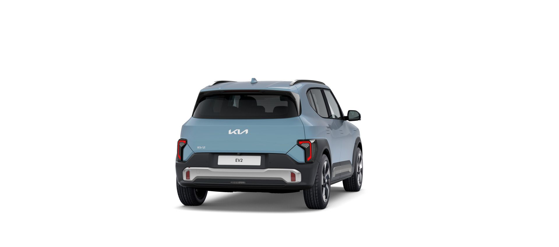 Kia EV2 azul claro en vista trasera tres cuartos sobre fondo neutro
