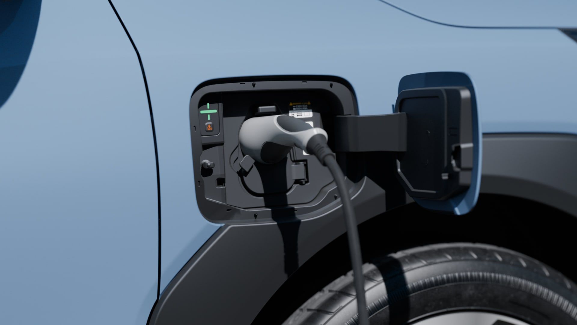 Detalle del puerto de carga del Kia EV2 azul con la rueda delantera al fondo