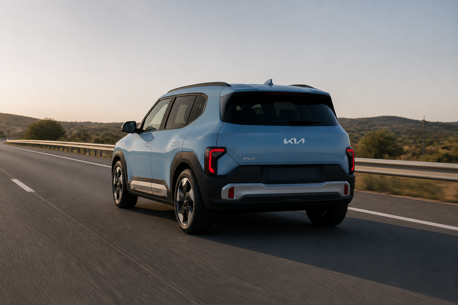 Kia EV2 azul circulando por el carril de una autopista despejada al atardecer