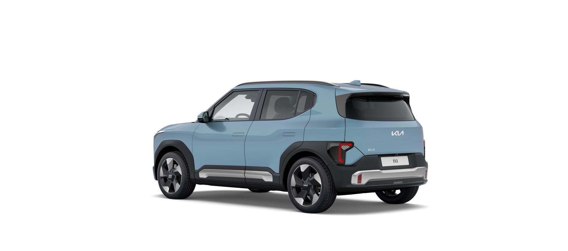 Kia EV2 azul claro visto desde la parte trasera en tres cuartos