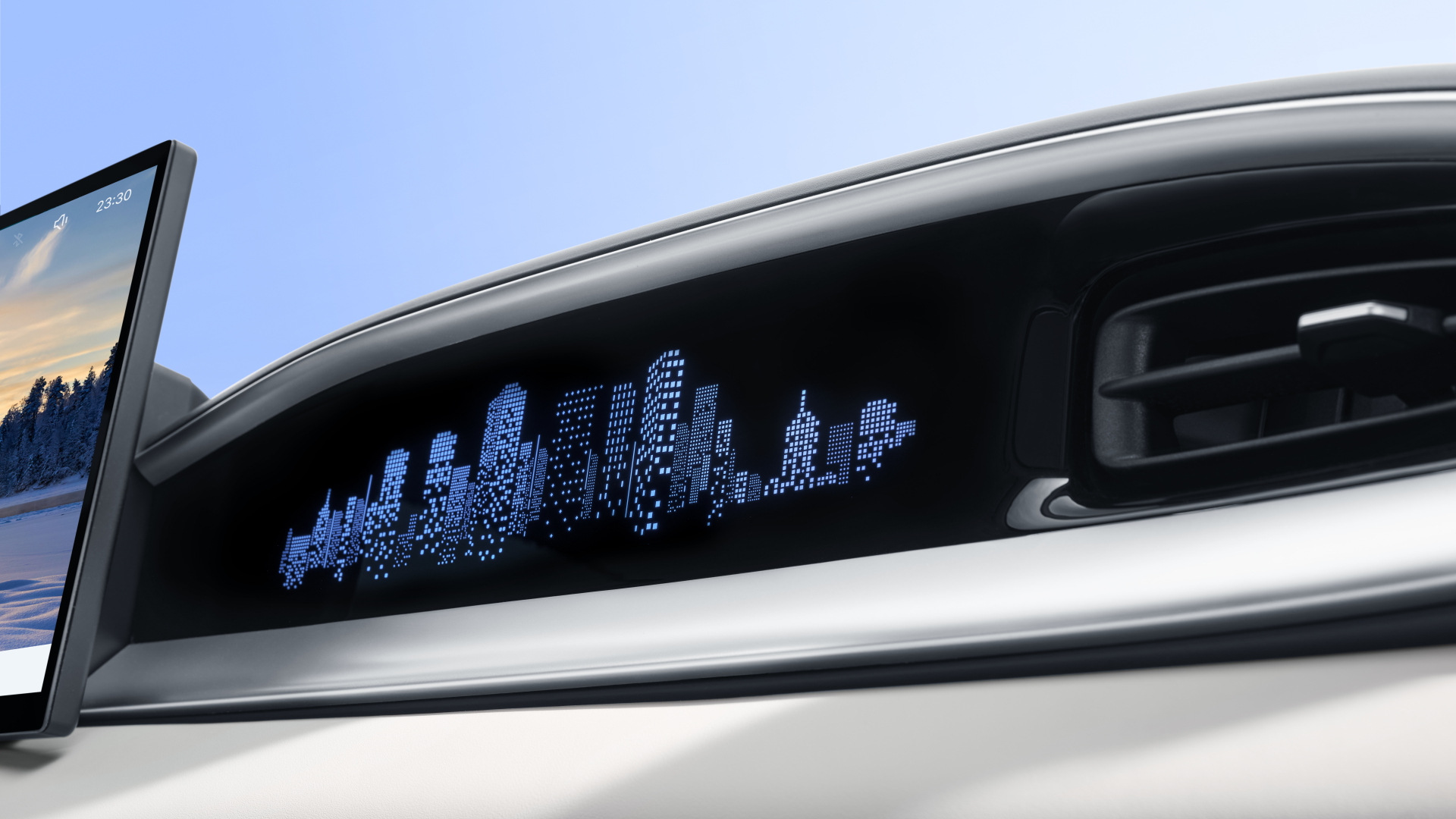 Tira decorativa iluminada del salpicadero con patrón de ciudad pixelado junto a la pantalla vertical